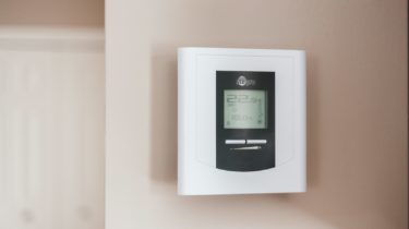 white and gray thermostat at 19 5